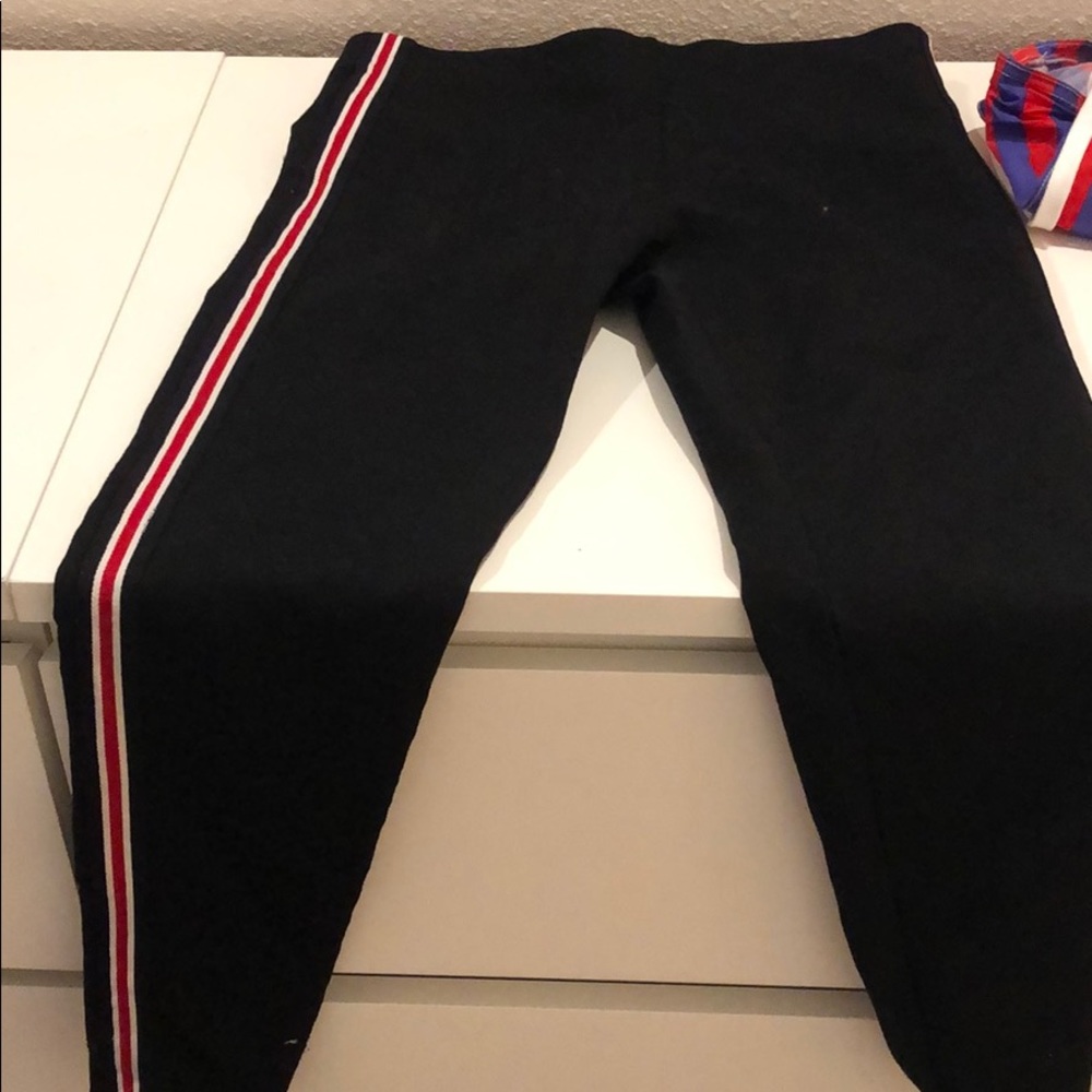 Black leggings with red stripe down the sides